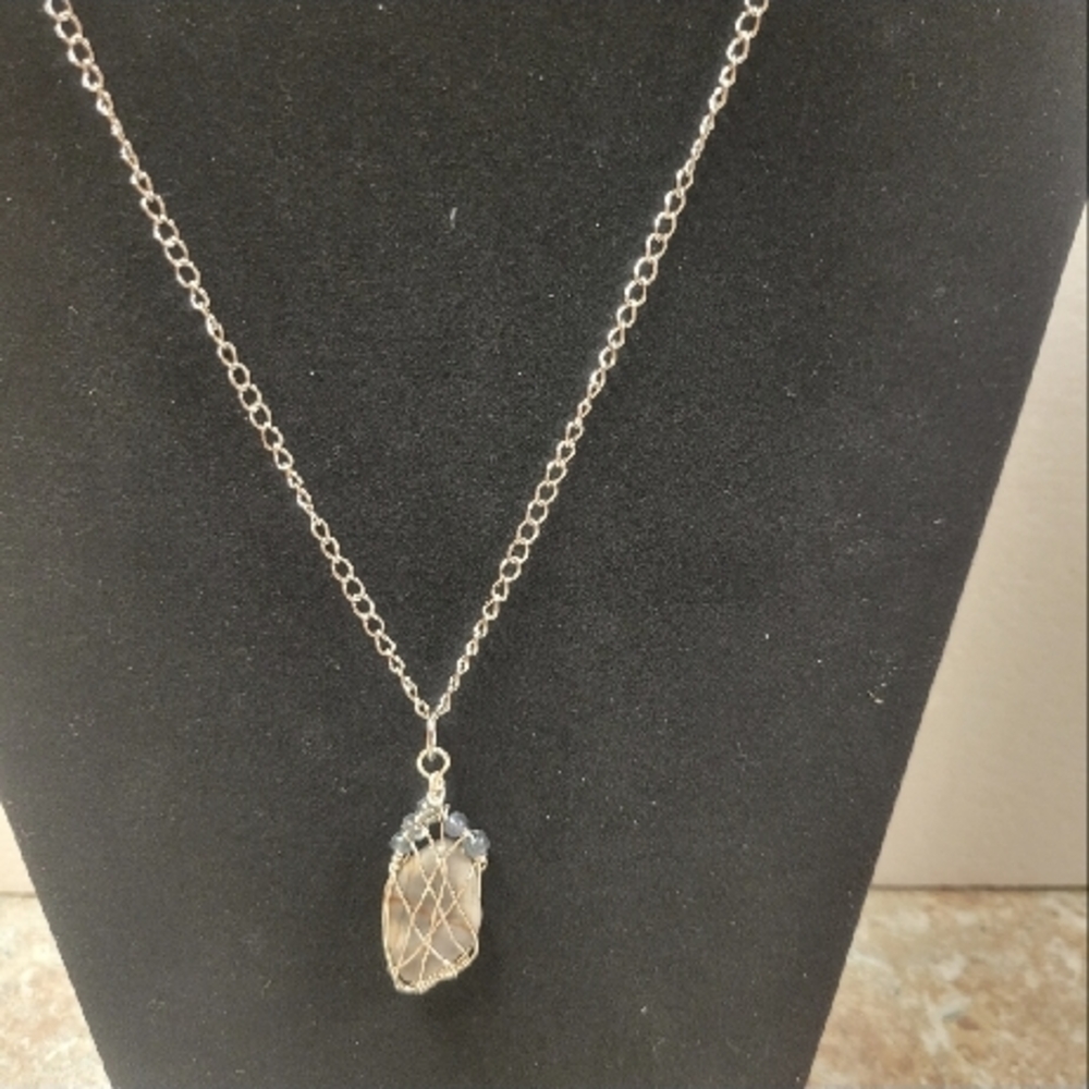 Elegant Silver Necklace with Intricate Brown Stone Pendant